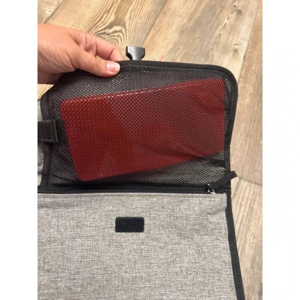 Travel diaper clutch and changing pad